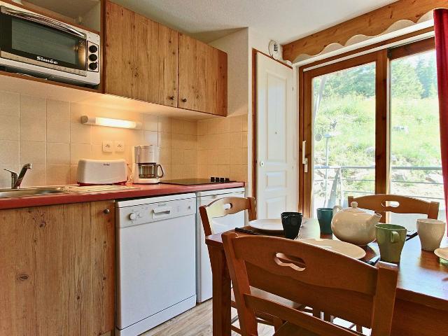 Esprit chalet pour cet appartement proche de toutes commodités - Chamrousse